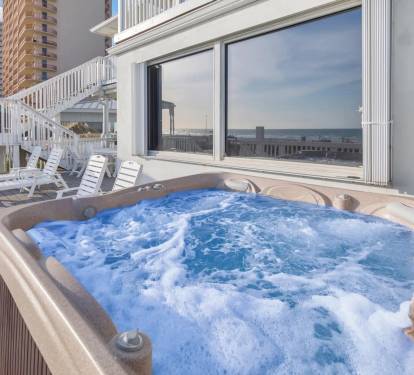 Unwind in the hot tub while soaking up panoramic views of the ocean and city.