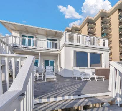 Prime beachfront home offering direct beach access and stunning panoramic views.