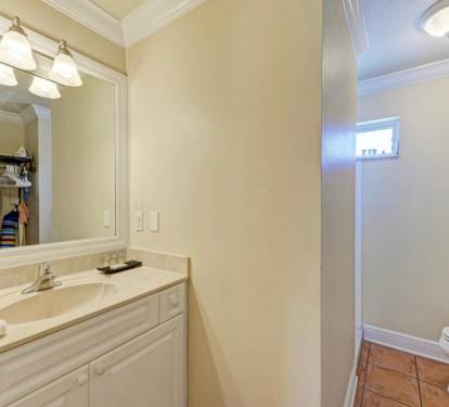 bathroom vanity (bathroom has been upgraded with a magnifying pullout mirror)