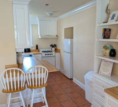 Full Kitchen, Refrigerator  and two bar stools for your comfort
