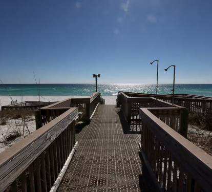 Easy board walk onto the white sand.