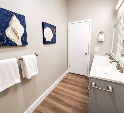 Hallway bathroom with double vanity 