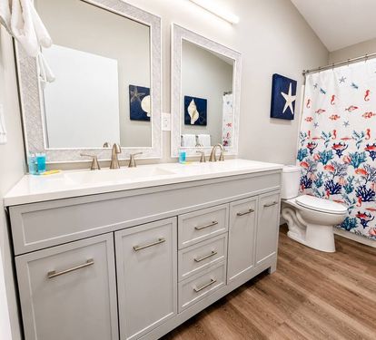 Hallway bathroom with double vanity 