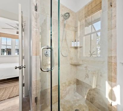 Rinse off the beach day in a roomy stone-tiled shower