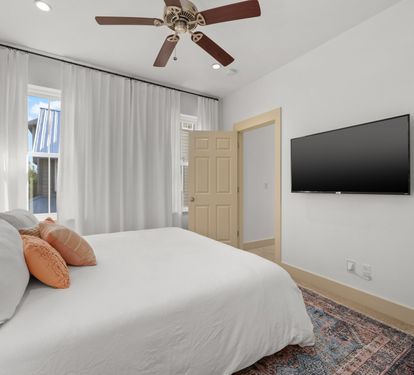 Second-floor King Suite 3 is on the quiet back side of the house with soft coastal light