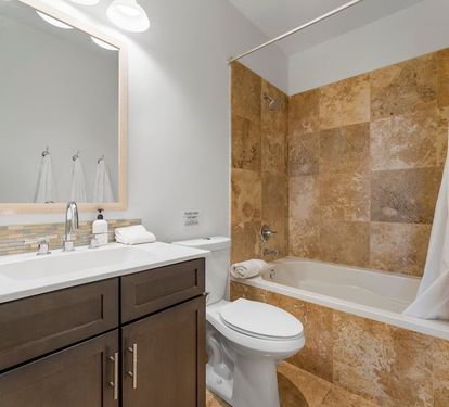 King Suite 2 private bath features a large soaking tub and shower
