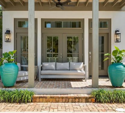 Settle onto the porch sofa and let the coastal breeze do the rest