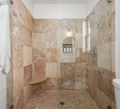 Second-floor King Suite 3- ensuite bath features a spacious walk-in shower with built-in bench