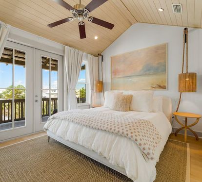 Wake up to vaulted ceilings, Gulf light, and your own balcony