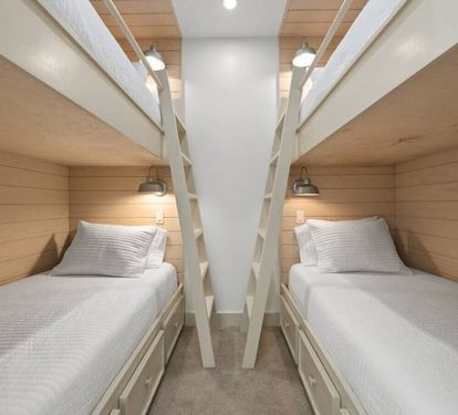 The bunkroom has 4 single beds and a streaming TV. It is located is a cozy nook on the 2nd floor and does not have a door.