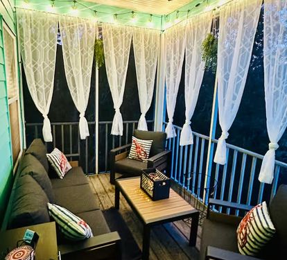 Screened Patio at night. Hanging lights, Ceiling Fan, Curtains, Keurig Coffee pot