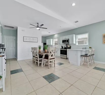 Dining space right off the kitchen with additional bar seating