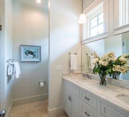Ensuite bath featues double sink custom marble &amp; tile bath.