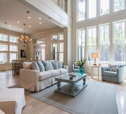 The open concept 1st floor features custom furnishings and overlooks pool.