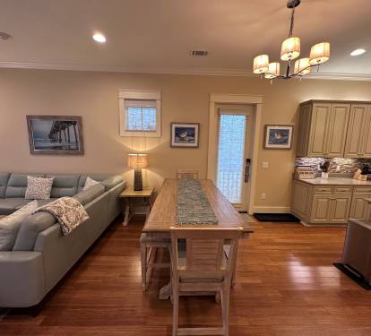 Dining Table seats 6 easily with seating for 2 more at the Kitchen Island.