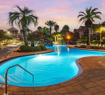 The zero-entry lagoon pool glows at night. The kids won't want to leave and honestly, neither will you.