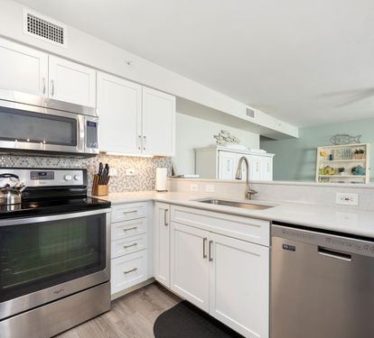 ?? "A Chef’s Dream. This updated kitchen features sleek granite countertops, a stunning tile backsplash, and stainless steel appliances—including a stove, refrigerator, dishwasher, and microwa