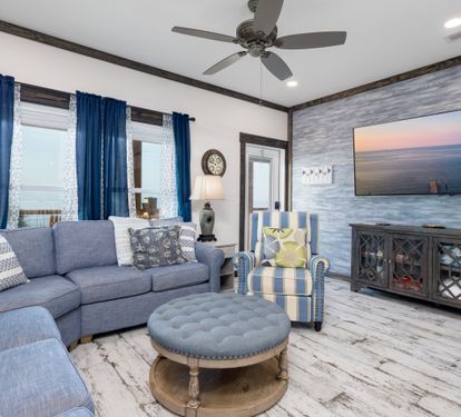 Large tv and plenty of seating with sleepre sofa
