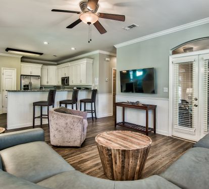 Spacious living room with direct access to the screened porch