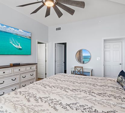 Master bedroom with wall-mounted Smart TV