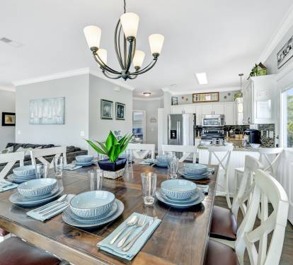 Kitchen table seating for 8 with 4+ additional seating at bar area.