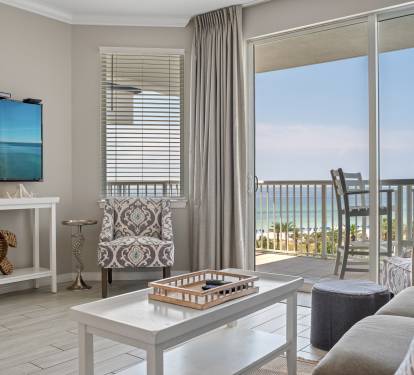 Floor-to-ceiling glass doors bring in natural light and connect to the balcony.