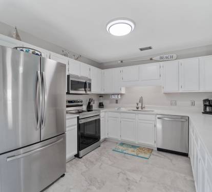 Kitchen fully stocked with modern appliances