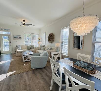 Sunnyside's living room and dining area are sunsplashed at the start of each day