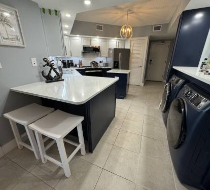 The newly remodeled Coast Kitchen features extended quartz counter tops for extra space and eating area for two.