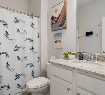 Bathroom 3: MIL Suite Warm, cozy bathroom perfect for your daily refresh with lots of drawers and cabinets.