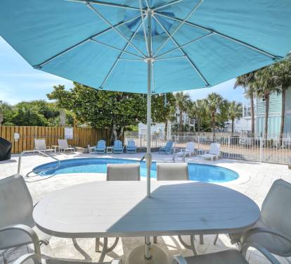 Enjoy relaxing poolside on the large deck.