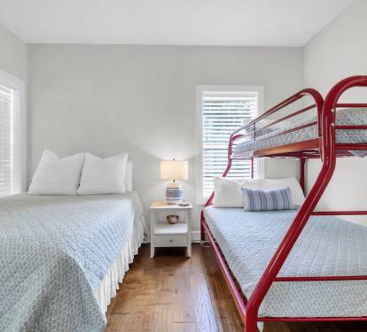 2nd downstairs bedroom has twin over full bunk and queen bed.