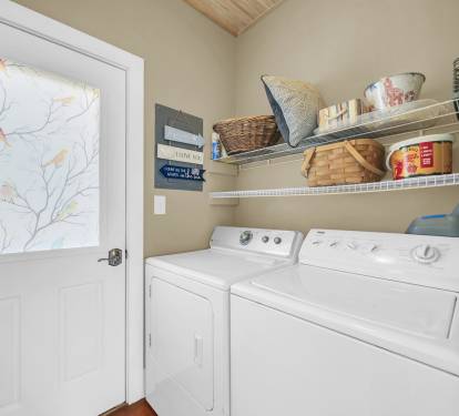 Laundry room located just off the kitchen.