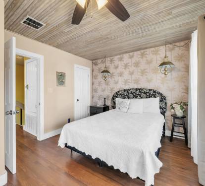 Upstairs master BR with queen bed, deck overlooking pool and ensuite bath.
