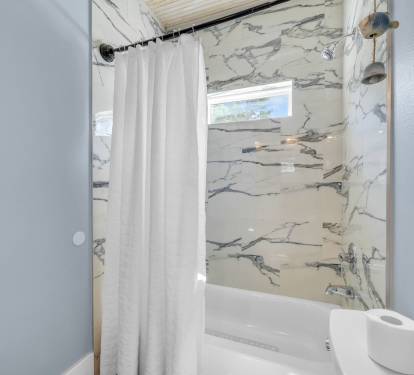 1st floor ensuite bath with double vanity and tub/shower combo.