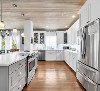 Beautiful new kitchen with new stainless steel appliances and countertops.