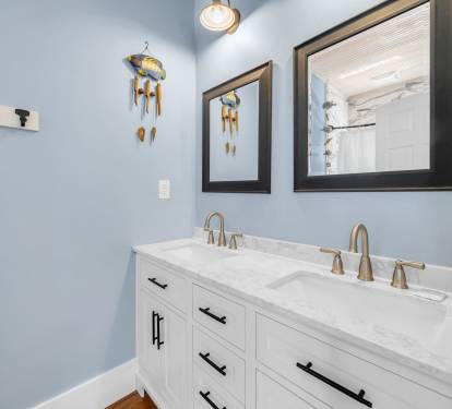 1st floor ensuite bath with double vanity and tub/shower combo.