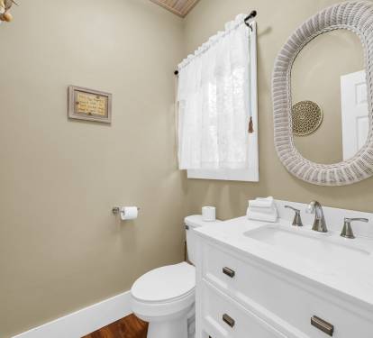 Half bath conveniently located just off the kitchen.