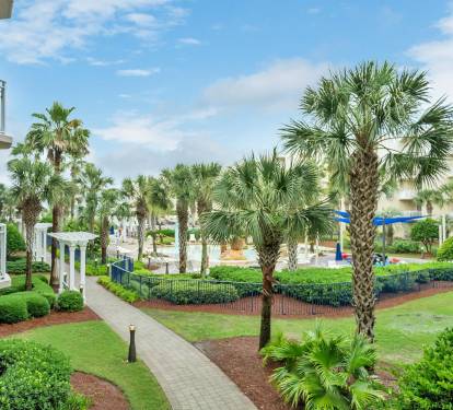 Landscaped resort grounds  and splash pad view from balcony
