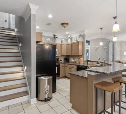 View of kitchen leading to upstairs