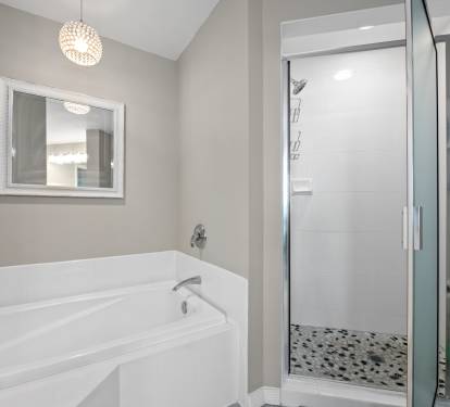 Soaking tub set in a bright bathroom, great for unwinding after a full day.