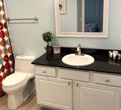 Pamper yourself after a day at the beach in the spacious primary bathroom.