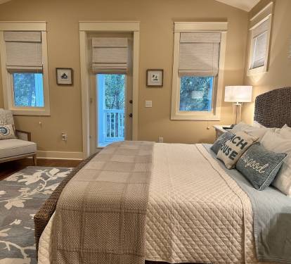 Master Bedroom #1 with 65” TV, KING bed & private porch.