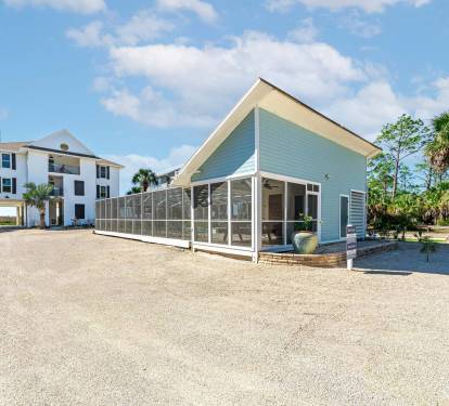 This Large Property Includes Screened-In Pool, Spa, and Pool House