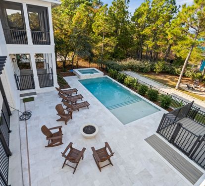 From the upper porch, you'll see it all at once — spa, fire bowl, and pool laid out below, ready whenever you are.