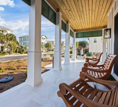 Relax on the front porch and take in the charm of this walkable coastal neighborhood. Enjoy views down Osprey Circle as neighbors stroll, bike, and pass by on golf carts with friendly waves. Rock for a while and feel at home, with the beach just a short w