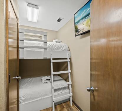 Enjoy comfortable and practical sleeping arrangements with these bunk beds in an enclosed room within the lower floor Master bedroom suite. Perfect for a small family with little ones to retre