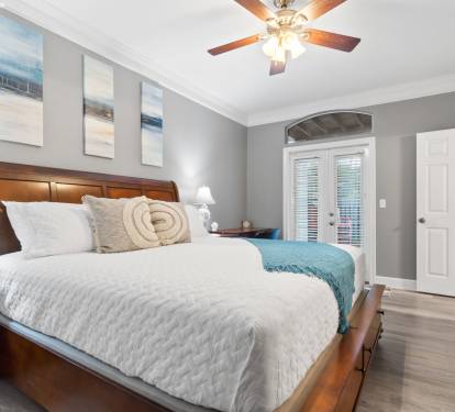 Master bedroom with a king bed on the main level and walkout