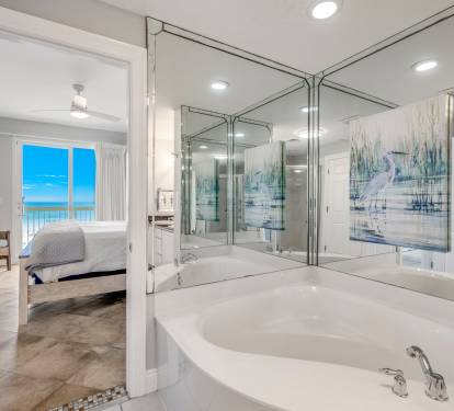 Large tub and walk-in shower with dual vanities