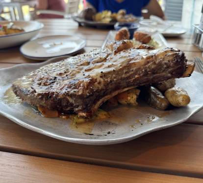 Bone in ribeye from CoastAL Restaurant. Located 1.3 miles east of Summer House, they serve breakfast, lunch and dinner with beach views, live music and retail shopping.